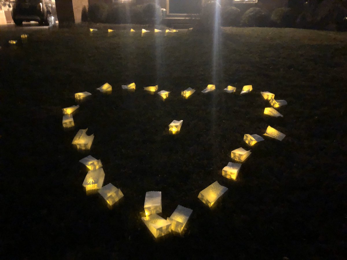 157. One of the kids just discovered that somebody arranged Japanese lanterns with tiny LED lights inside in the shape of a heart on our front lawn.