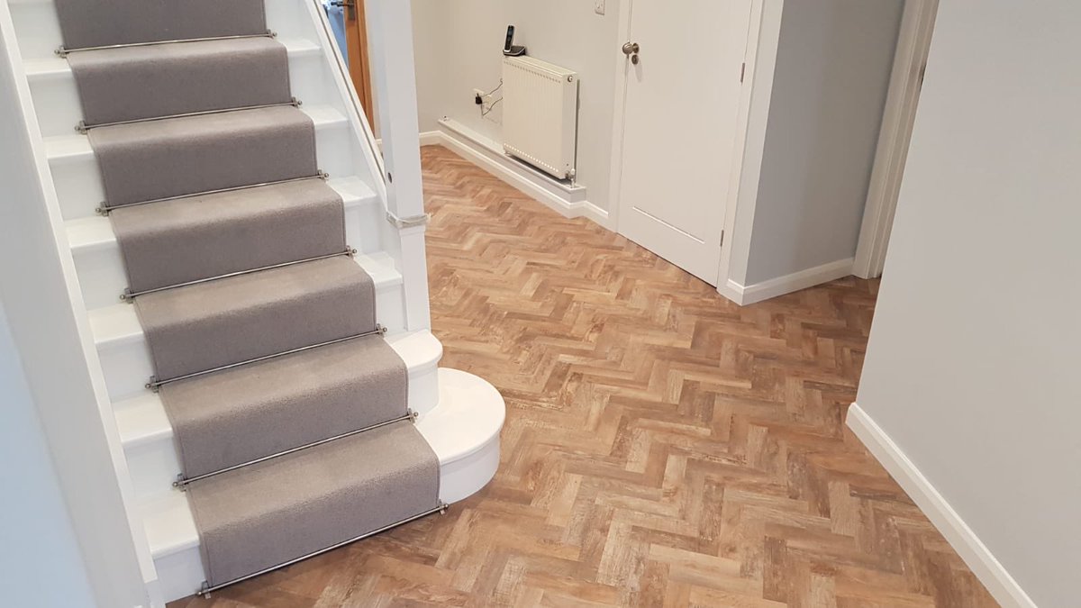 smith_and_sons's tweet photo. Recent install before Christmas in @ModuleoUK small plank herringbone transforming this hallway. The stair runner and rods really finishes off this lovely job! #herringbone #lvt #flooring #carpet #stairrunner https://t.co/WiFITh0GKF