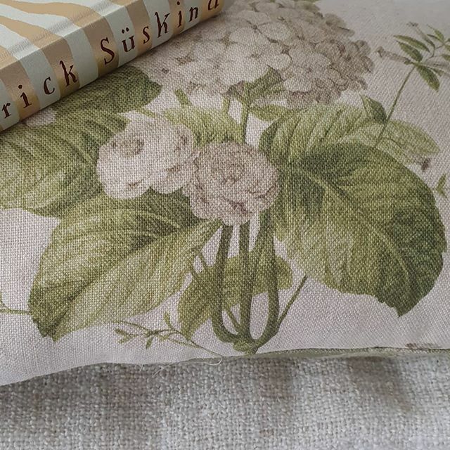 HEIDI Mist 1010-6,  with its trailing hydrangea design is perfect for a scheme of WINTER WHITES. Seen here as an accent cushion, this beautiful linen from The Spring Garden Collection is suitable for curtains, blinds and upholstery. #thedesignarchives #t… ift.tt/2N0FKxF