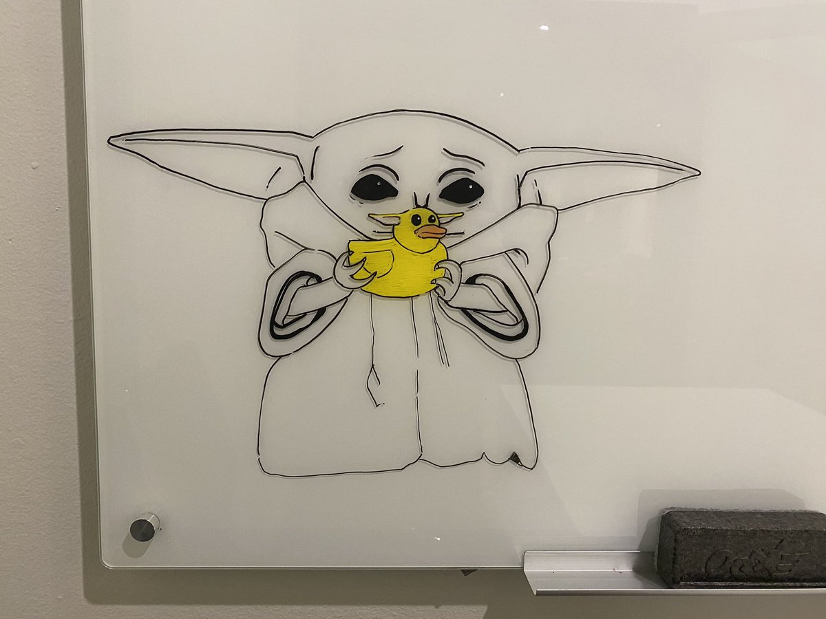 Baby yoda holding a rubber ducky