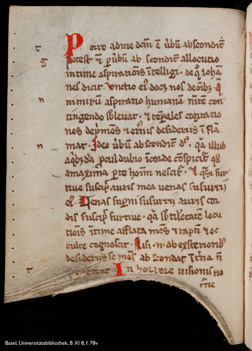 Photo of a leaf from a medieval manuscript showing 17 lines of abbreviated Latin copied in brown ink and decorated with brilliant red majuscules. The parchment leaf is an offcut—a lower-quality scrap from the edge of the treated hide—and has an unusual shape, with a large, scooped-out ‘gap’ at the bottom. Shelfmark: Basel, UB, B XI 8, f. 78v.