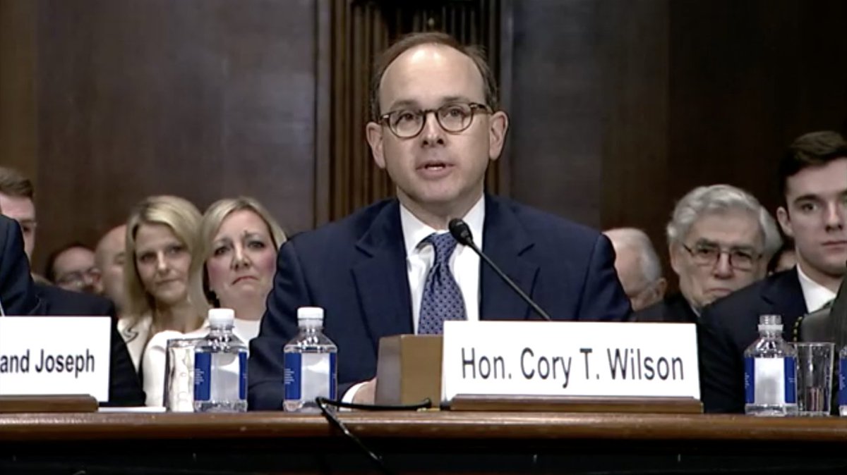 Cory Wilson, one of Trump's district court nominees, sits inside the Judiciary Committee hearing room for his confirmation hearing.
