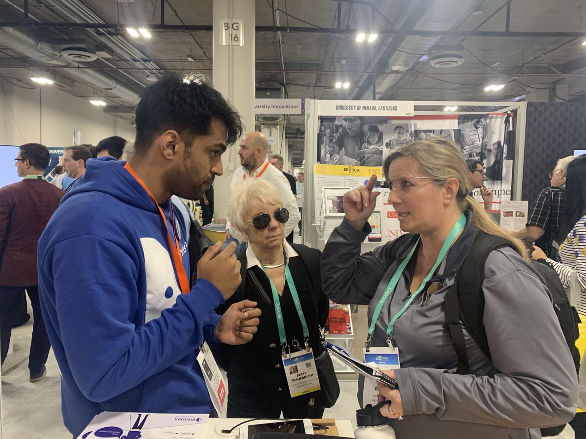 A guest at the Envision booth trying on the glasses.
