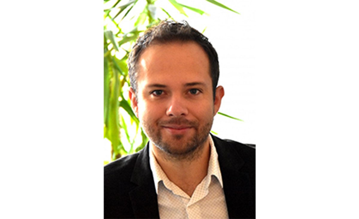 man in front of plants