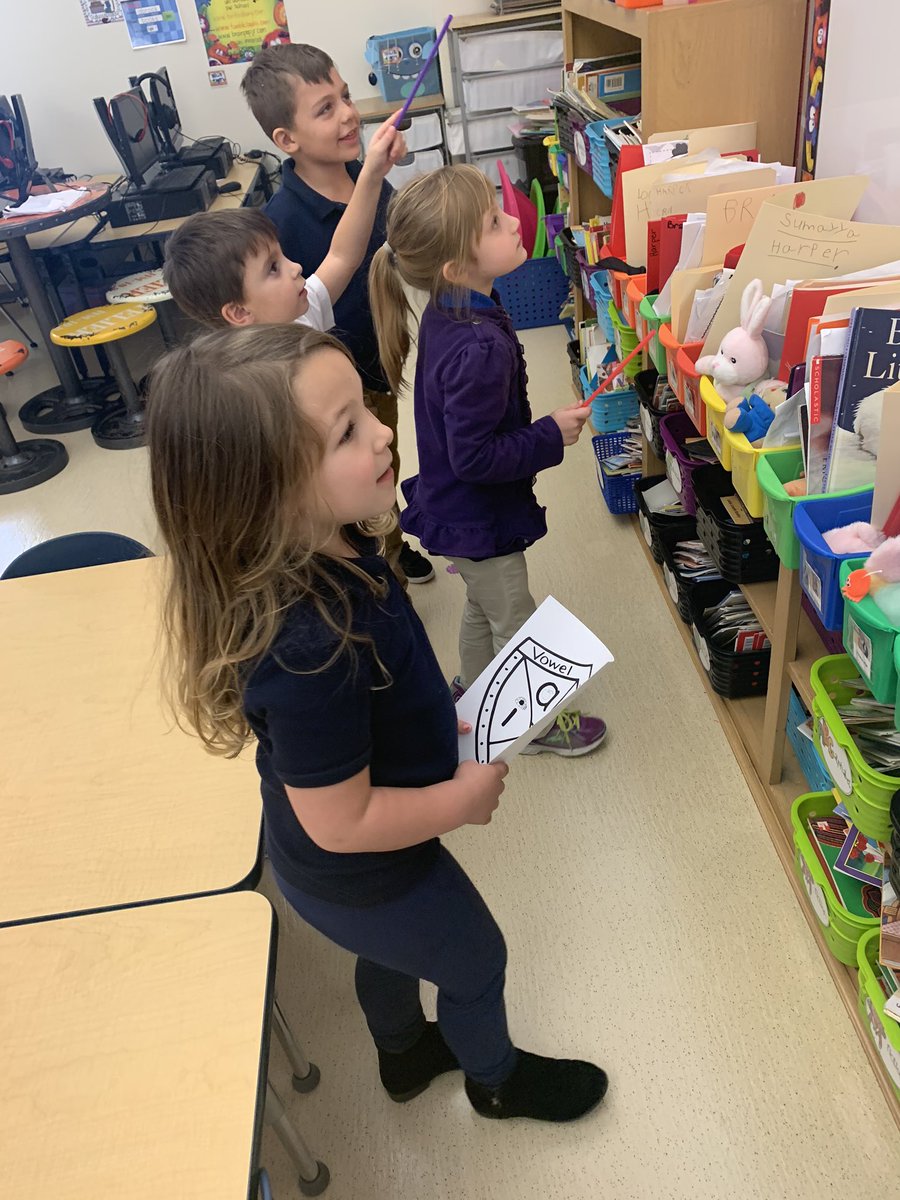 jostsboasts's tweet photo. Shields went up in KinderRoo land today! We activated our vowel power &amp; used our vowel shields &amp; pointers reader man sent us to walk around the room &amp; find vowels in words! @BrockTigers https://t.co/Cexuog37eL