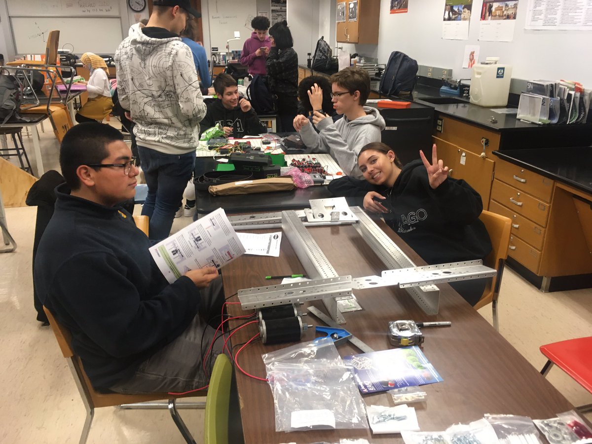 scischmidt's tweet photo. Getting crowded in the build space. The base is complete. Now to leave the world of instructions behind. #omgrobots @Taft_HS @FRC8122 #stem #needmorehands https://t.co/VCQbmqhter
