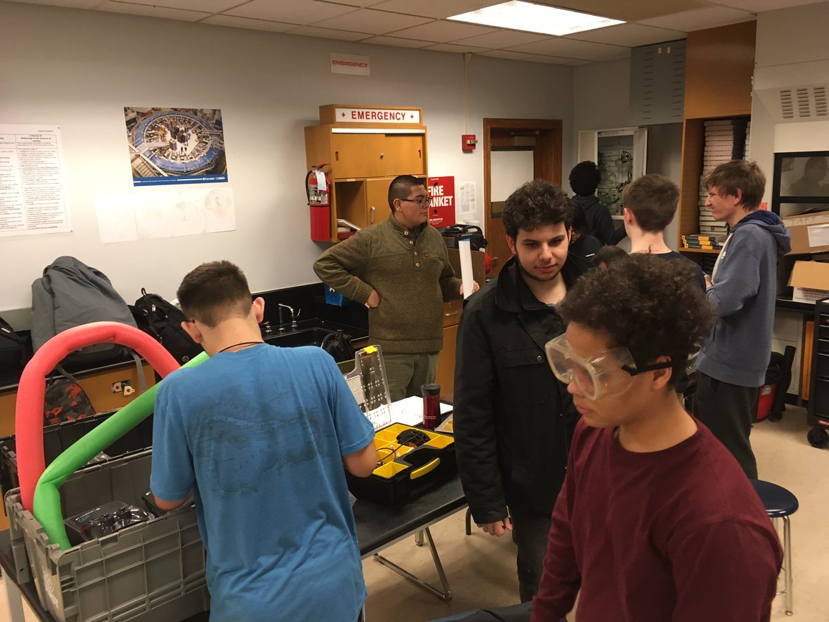 scischmidt's tweet photo. Getting crowded in the build space. The base is complete. Now to leave the world of instructions behind. #omgrobots @Taft_HS @FRC8122 #stem #needmorehands https://t.co/VCQbmqhter