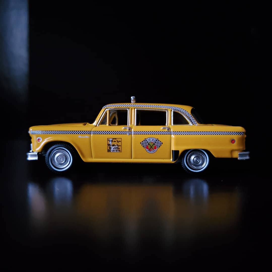 I haven't posted in a while due to there not being many car shows this time of year, so here's a couple of pictures of a diecast Checker cab I got recently.