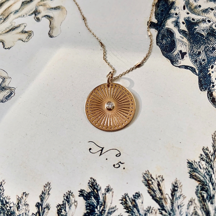 The sun meets the sea in ZC's Sunbeam medallion necklace. 🌞 #lovelindys
#jewelryessentials #designerjewelry #zoechicco #madeinlosangeles #madeintheusa #diamondnecklace #thenewheirlooms #lindysjewelry #coolstores #finejewelry #ameliaisland #fernandinabeach #lindys