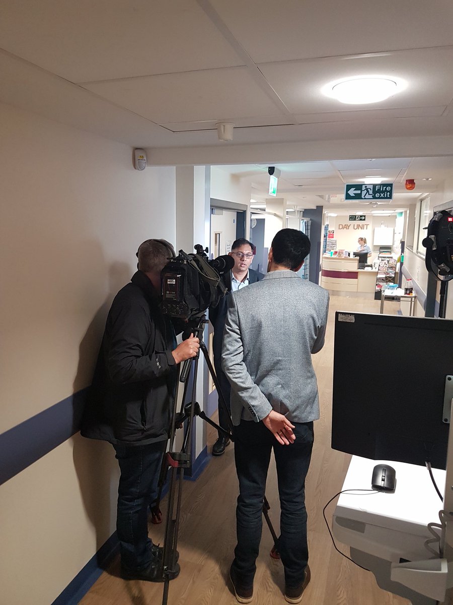 Dr Ram Malladi with camera crew in University Hospital Trust