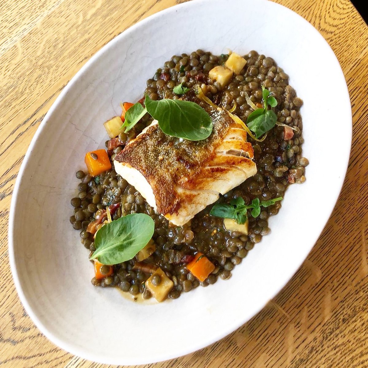 ScranandScallie's tweet photo. Roast cod, puy lentils & pancetta. Lovely dish for the colder months! #cod #puylentils #pancetta #localproduce #fromnaturetoplate #fromseatoplate #glutenfreeedinburgh #gastropub #bibgourmand #tomkitchin #edinburgheats #edinburghfoodies #scranandscallie #stockbridge #edinburgh https://t.co/IhcDzsaOOd