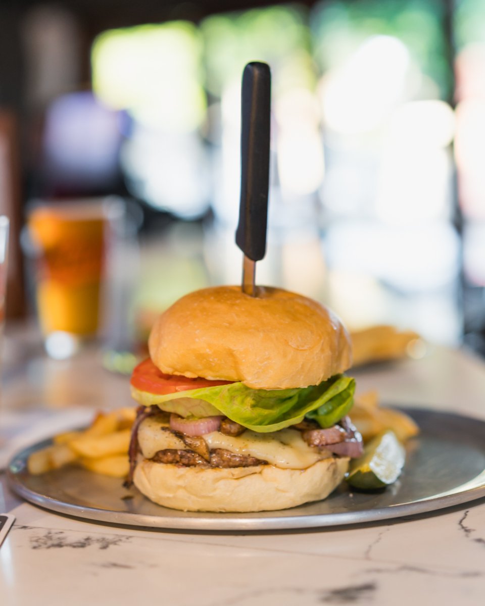 Our burgers are as delicious as they are stacked tall!