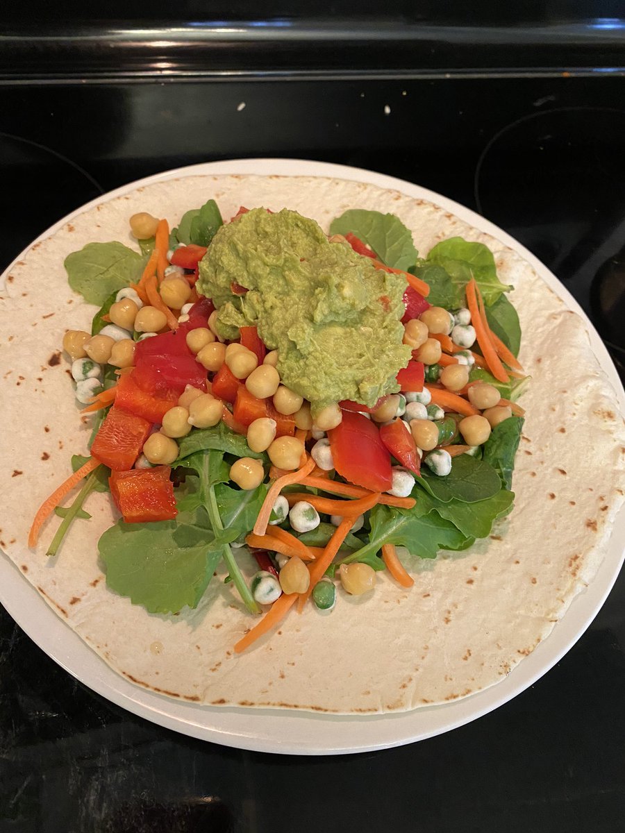 A wrap is the perfect vehicle for food. Awesome #vegan wrap for lunch. Kale mix, red bell pepper, wasabi peas, chickpeas, carrot, little Italian dressing guacamole. 🔥🌱