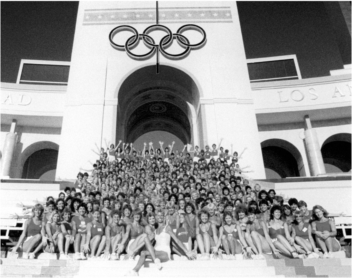 Core to  #FitNation is understanding how  #fitness + sport are interconnected but differentFitness often gendered female, discounted as non-competitive + lesser than sportThis pic of the  @JazzerciseInc performance at LA 84 Olympics evokes this at-times fraught relationship/3