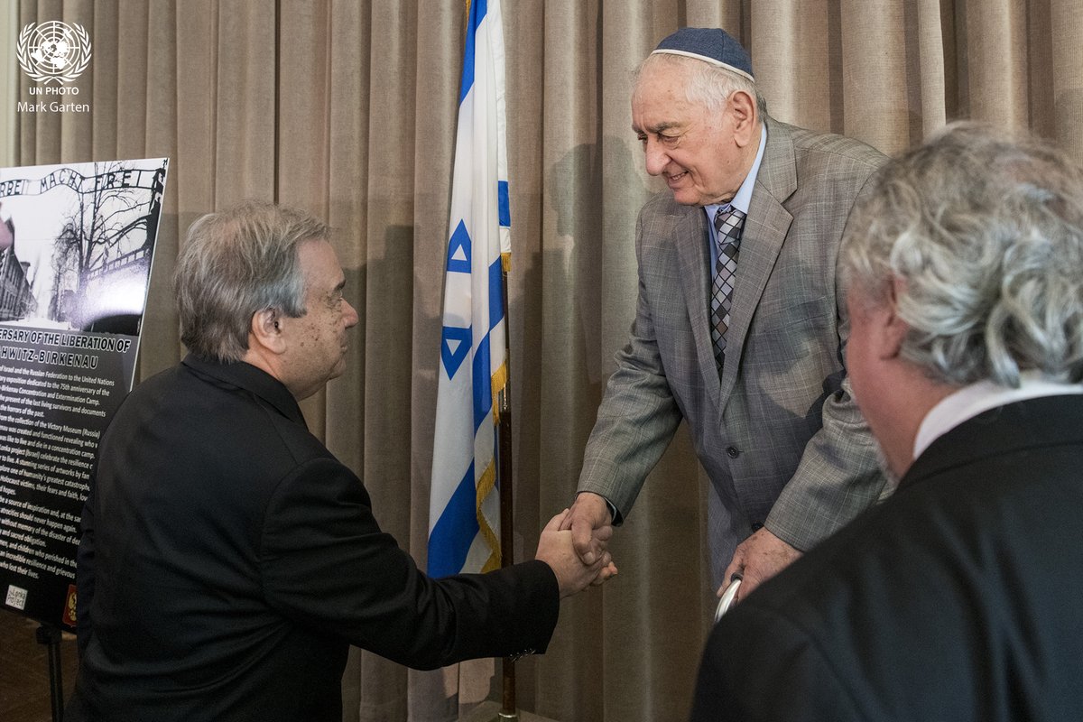 UN_Photo's tweet photo. Secretary-General @antonioguterres greets Zoltan Matyash, #Holocaust survivor of Auschwitz and Buchenwald, at the opening of the exhibition commemorating the 75th Anniversary of the Liberation of Auschwitz-Birkenau @UN Headquarters today. #WeRemember https://t.co/h9b7UsuFTj