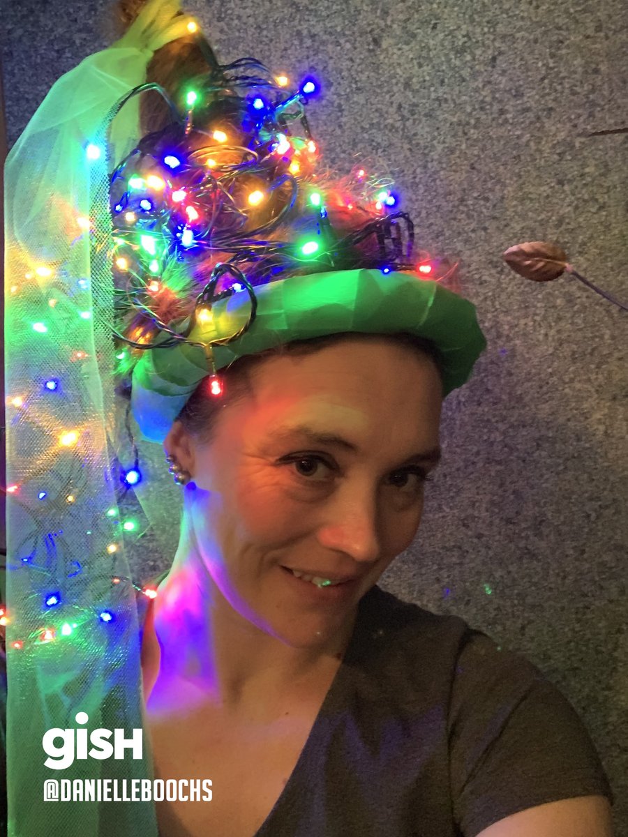 Woman wearing a hat made with lights.