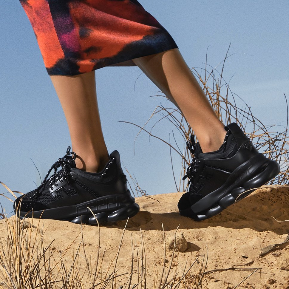 Versace's tweet photo. Recognizable details - Medusa, Greca and Braille lettering stand out in texture on the all-black iteration of the classic #VersaceChainReaction sneakers.
Find them now: https://t.co/KZsJI8WdZo https://t.co/NGn79Il79t