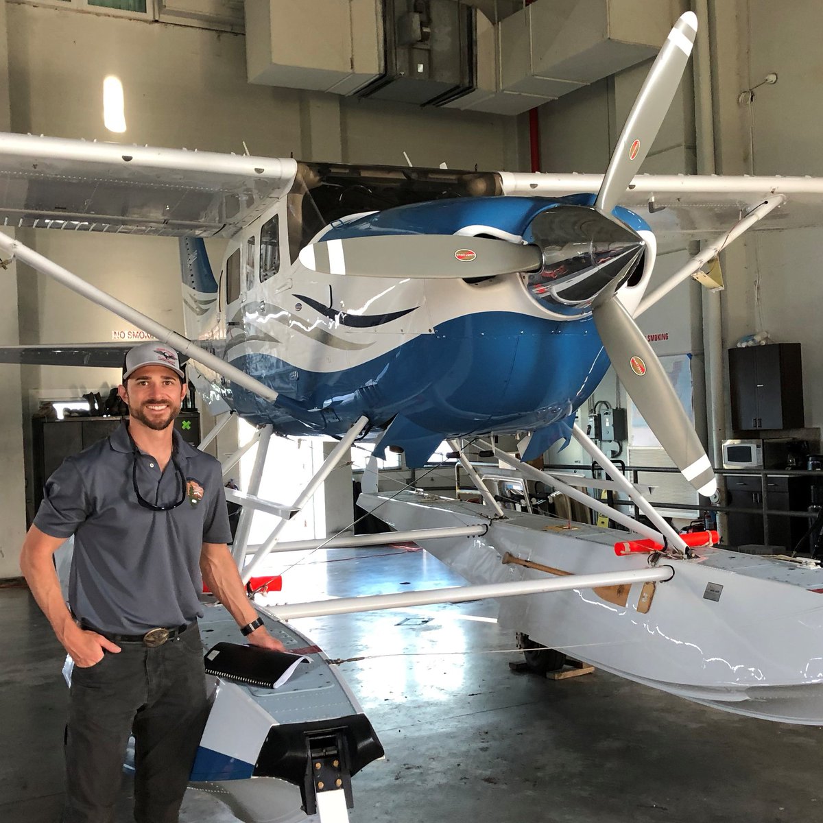 Justin Jager standing by airplane.