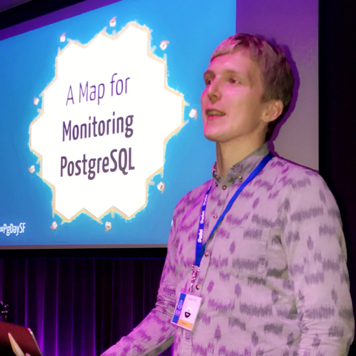 @LukasFittl on stage presenting at #PgDaySF 2020