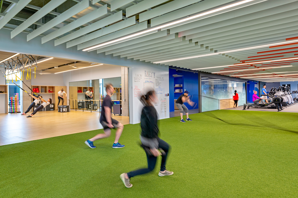 Employees exercising in turf room. 