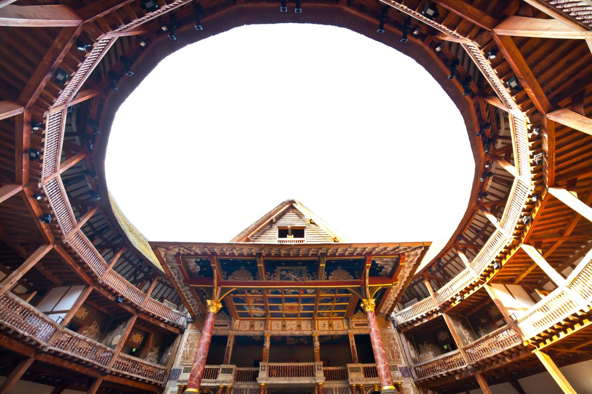 Interior shot of the Globe Theatre looking up to the sky.