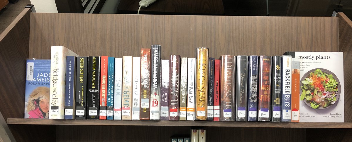 More books out of boxes and ready for check out.  Remember to check the genre color on the spine. Find your favorite color and read them all. #gwaealibs  @CR_Libraries