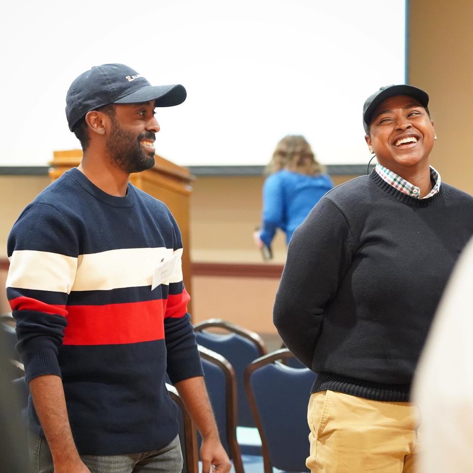 Two people laughing.
