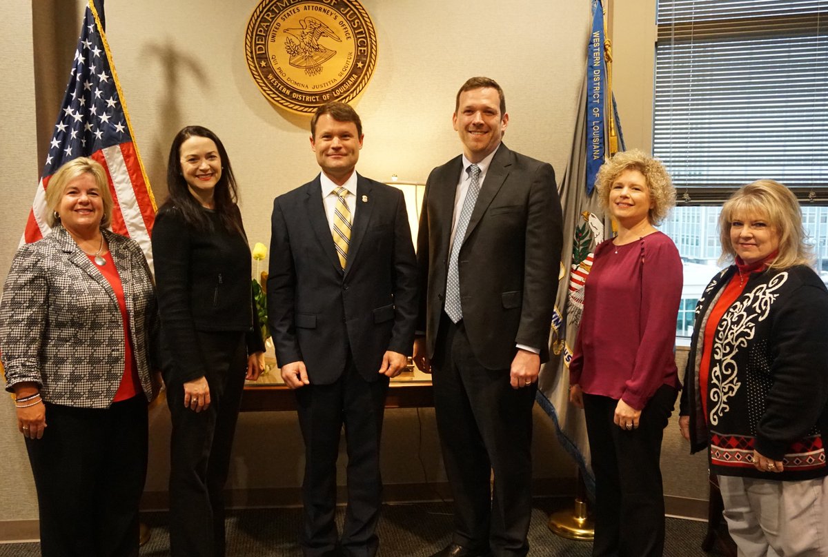 Photo of U.S. Attorney’s Office prosecutors and support staff with U.S. Attorney.