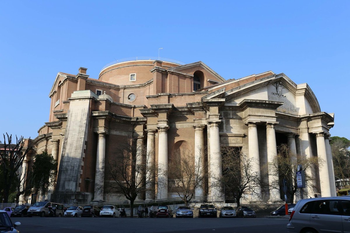 This is the Basilica del Sacro Cuore Immacolato di Maria, Parioli, Rome, by Armando Brasini, 1923-51, which shows that coming together of monumental ruination with baroque urban form very well...