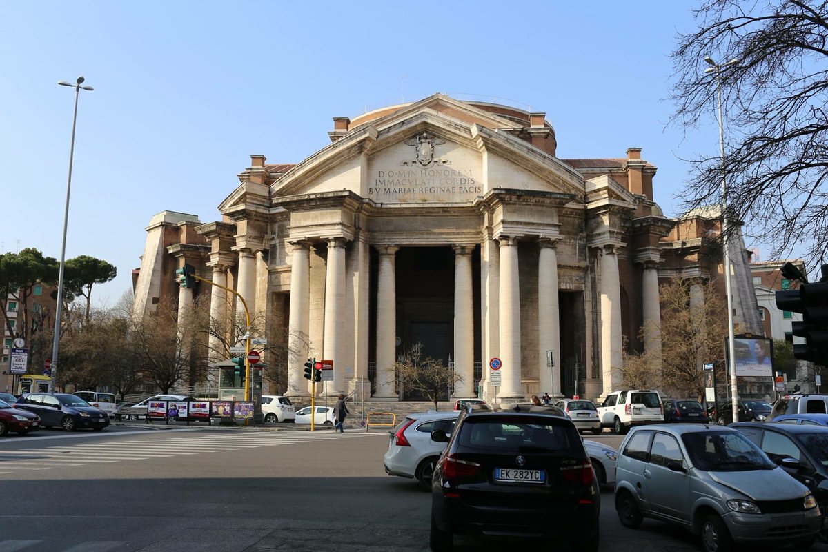 This is the Basilica del Sacro Cuore Immacolato di Maria, Parioli, Rome, by Armando Brasini, 1923-51, which shows that coming together of monumental ruination with baroque urban form very well...