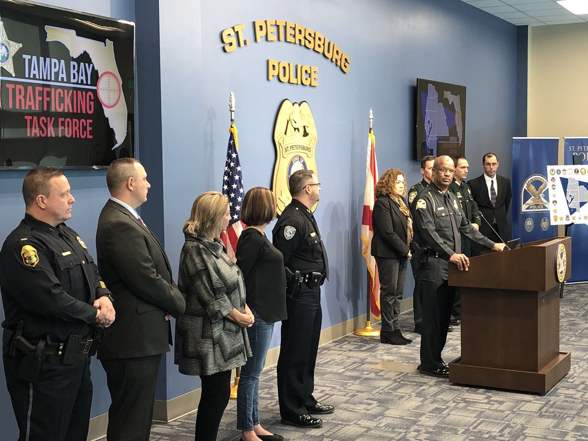 Chief Holloway and US Attorney Maria Chapa Lopez and officers are a podium.