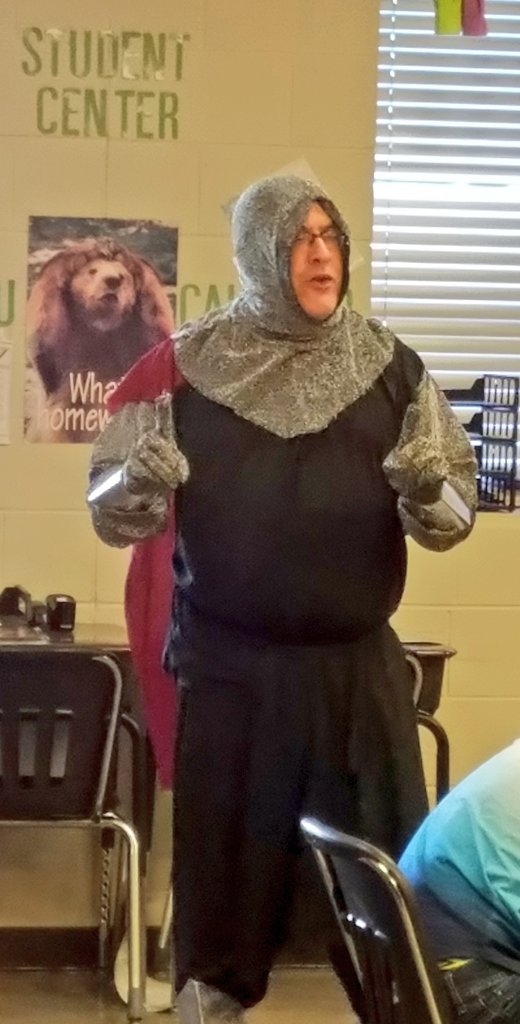 JohnathanGraf's tweet photo. #TLAP or teach like a knight.  Mr. Smith captivates students w/ his knightly attire and old English accent to start his middle ages unit. Teacher passion and Student engagement... @burgessdave https://t.co/adr6Td07eq