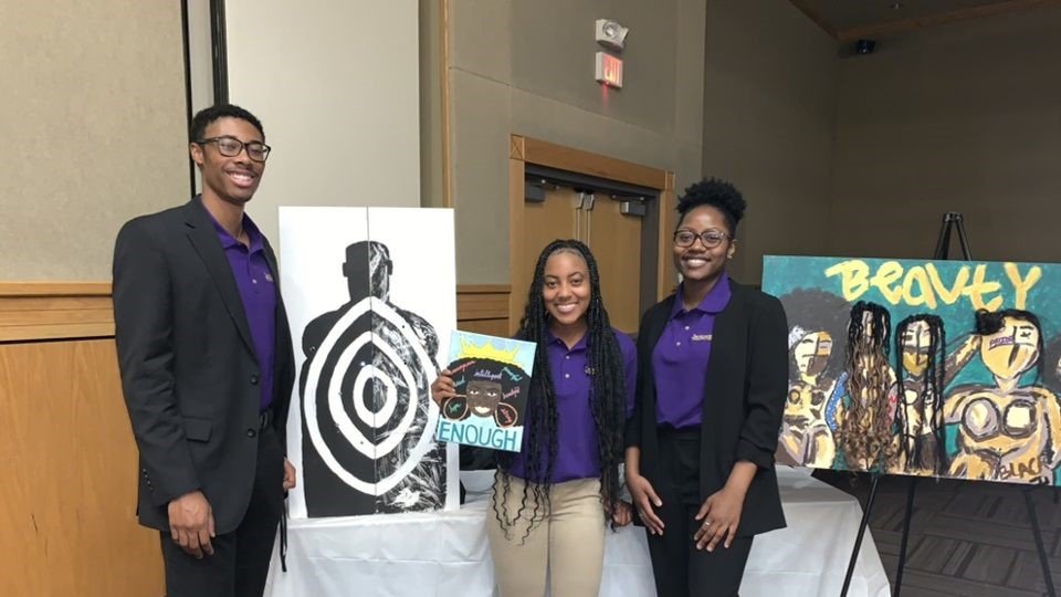 HonorsPvamu's tweet photo. Pictured below are three of The Honors Program Students showcasing their artwork during the MLK Art Show that was held here on the campus of PVAMU. Pictured: Mr. Stanley Hamilton-HP X, Ms. Kaitlyn Hampton-HP X, and Ms. Alexandria White-HP X. #pvamu #pvhonorsprogram https://t.co/vMaGULcU3K