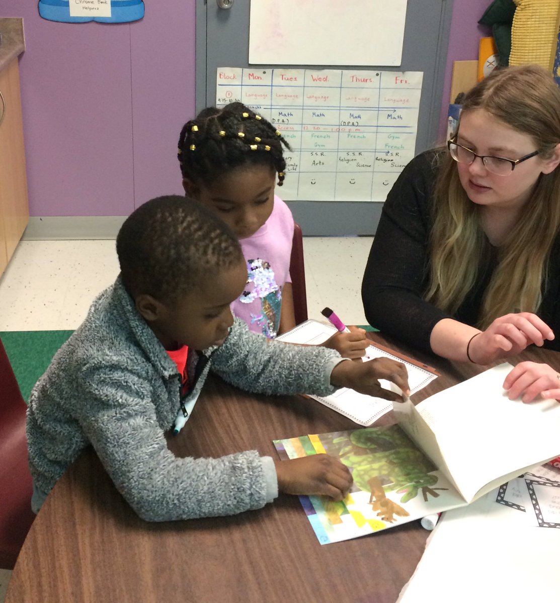 Students very engaged in Math centres involving telling time and identifying money amounts <a href="/StMartinOCSB/">St. Martin de Porres School</a>