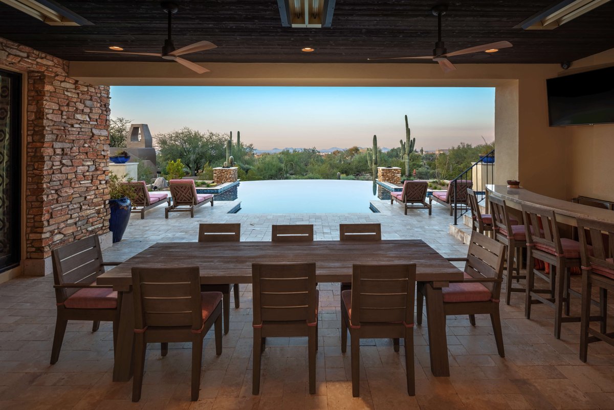Check out this gorgeous pool we built in Scottsdale! It has a negative edge which gives you the illusion that the water runs right into the desert #NegativeEdge #ScottsdaleAZ