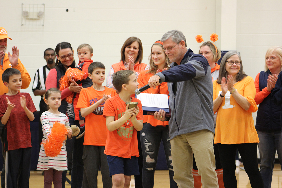 Last night we celebrated a very special occasion with Knox Walker and his family. Knox rang a bell to signify the end of his three-year battle with Acute Lymphoblastic Leukemia before our evening athletic events.