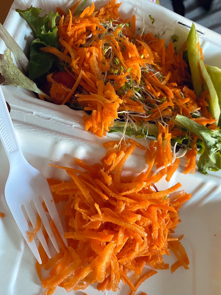 A small salad with a fuck load of shaved carrots