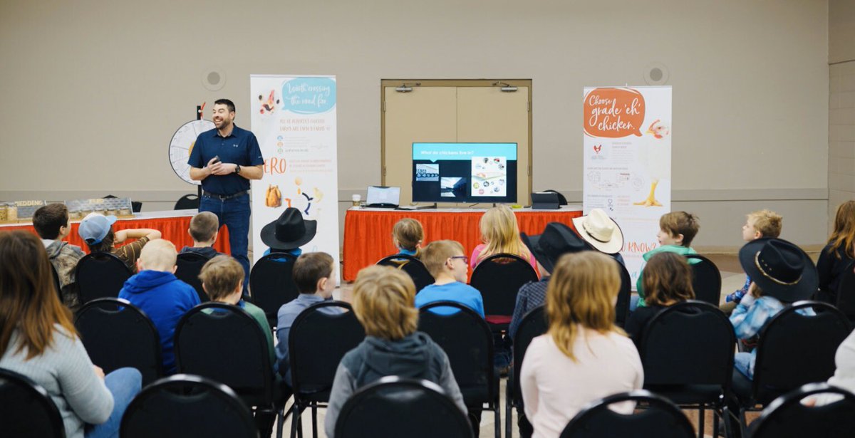 Alberta_Chicken's tweet photo. We’re on day two of Camrose Bull Congress! Thank you Andre and Hinke for volunteering to teach grade 3/4s from the Camrose area about chicken farming! 😀 @CamroseRegional #abchicken https://t.co/98gfCLrO61