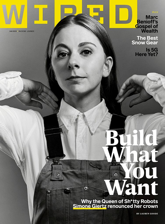 a magazine cover. a woman wearing overalls