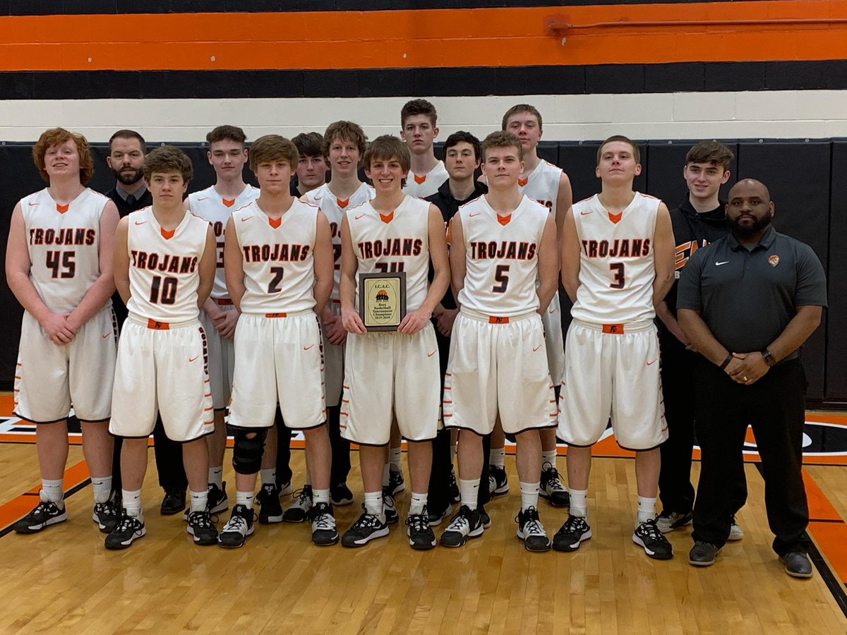 EHSTrojansBball's tweet photo. EHS Basketball, the gentlemen in this picture, and plenty of other alumni owe their foundation in the game to @jimvalla who was honored tonight by the IBCA at his final home game. Thanks for impacting so many lives over the years, Coach! #trojanforce322 #relentlesstogether https://t.co/oVnaw98zae