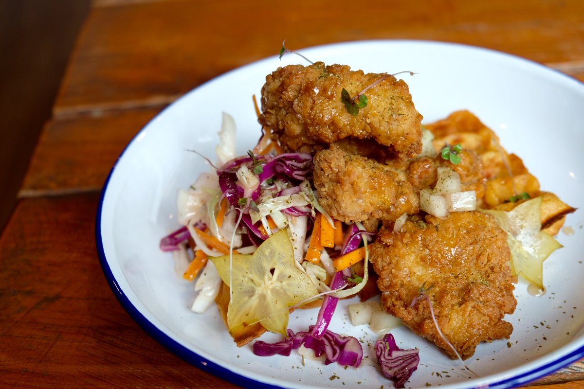 Our new waffle special - maple brined fried chicken, tomato and thyme waffle, slaw, pickled starfruit and watermelon rind, herb maple and herb ash.

#littleclive #brisbane #brisbanefood #brisbaneeats #waffles #brisbanebrunch #annerley #moorooka #tarragindi #yeronga #duttonpark