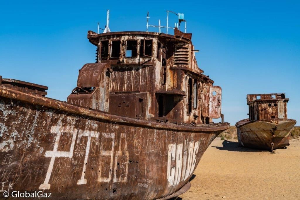 Global_Gaz's tweet photo. The road to the #Aral Sea goes through the old sea port of #Muynak.  Sadly, the town has been devastated by the destruction of the Aral Sea.  You can see ships that now lie in a desert instead of sea. Travel to the Aral Sea in #Uzbekistan with @AyimTour. https://t.co/qox9CwrDDX https://t.co/Q2XodLZ3dG