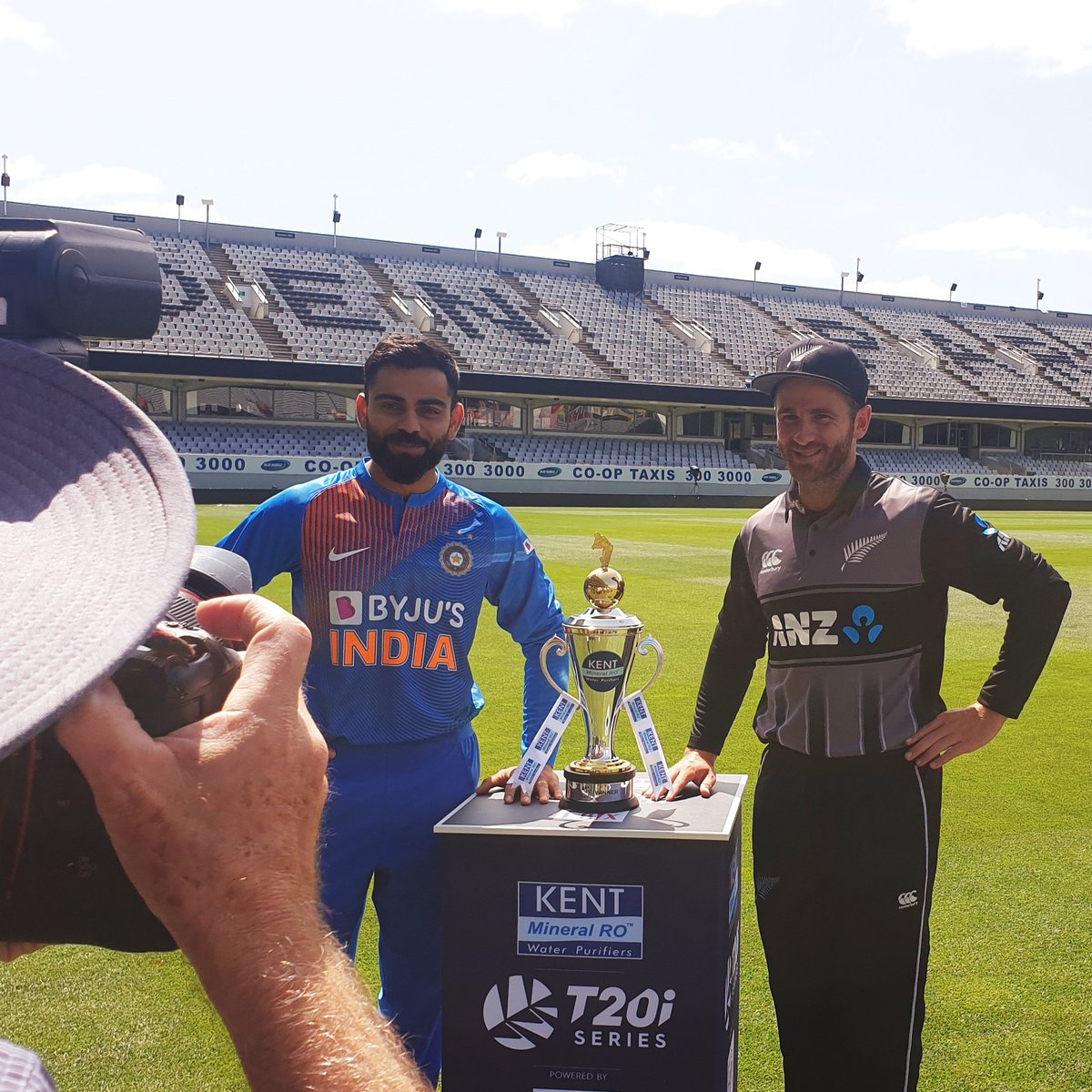 BCCI's tweet photo. The two captains all smiles as they pose with the trophy ahead of the 5-match T20I series #NZvIND https://t.co/TRGAAZ8nl1