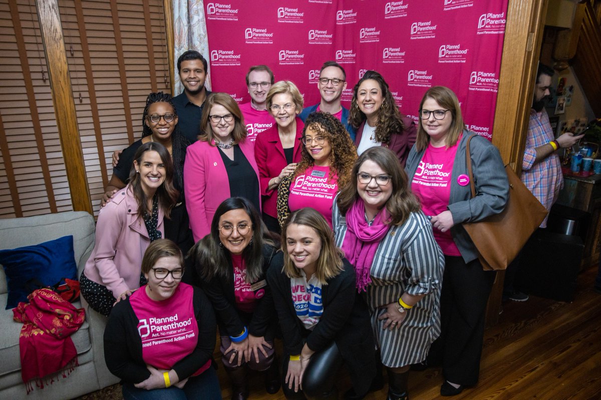 Elizabeth Warren takes a photo with supporters.