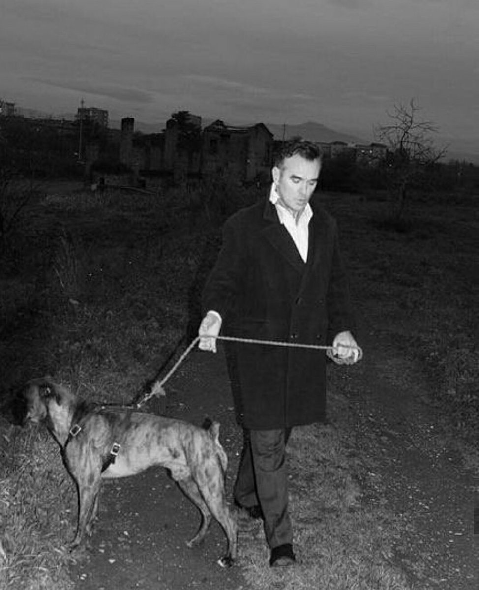 mozholdingstuff's tweet photo. Morrissey holding a dog on a leash
#iamnotadogonachain https://t.co/YlFrDiI5WZ
