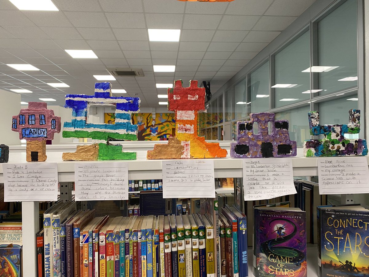 ASMLibrary's tweet photo. Ms. Jenna has displayed some new #G4 artwork on top of the library bookshelves. Stop by and take a look! #ASMrocks #artrocks #STEAM #codeweek #codeweek2019 #codeweekmilano #architecture #librarylife https://t.co/GZt3dmU1dW