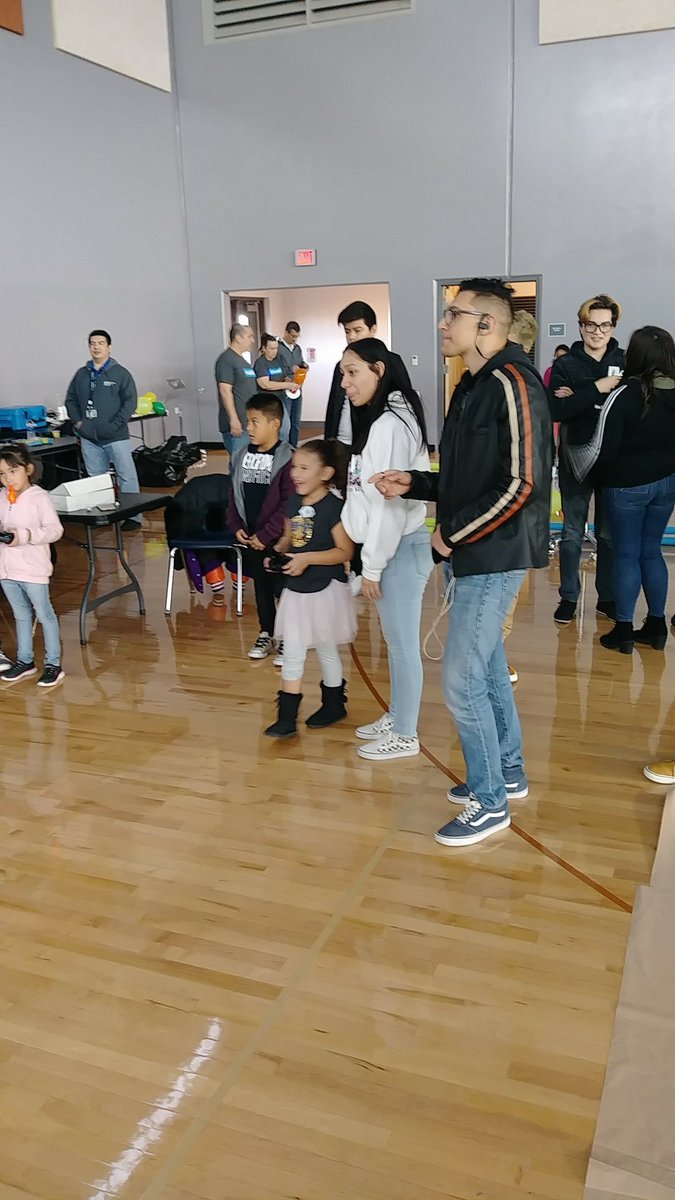 FALCONS_FixIt's tweet photo. Falcon Engineering volunteers at the ROBOCOM event showing kids how easy it is to fly a drone. https://t.co/55UKVI1hQA