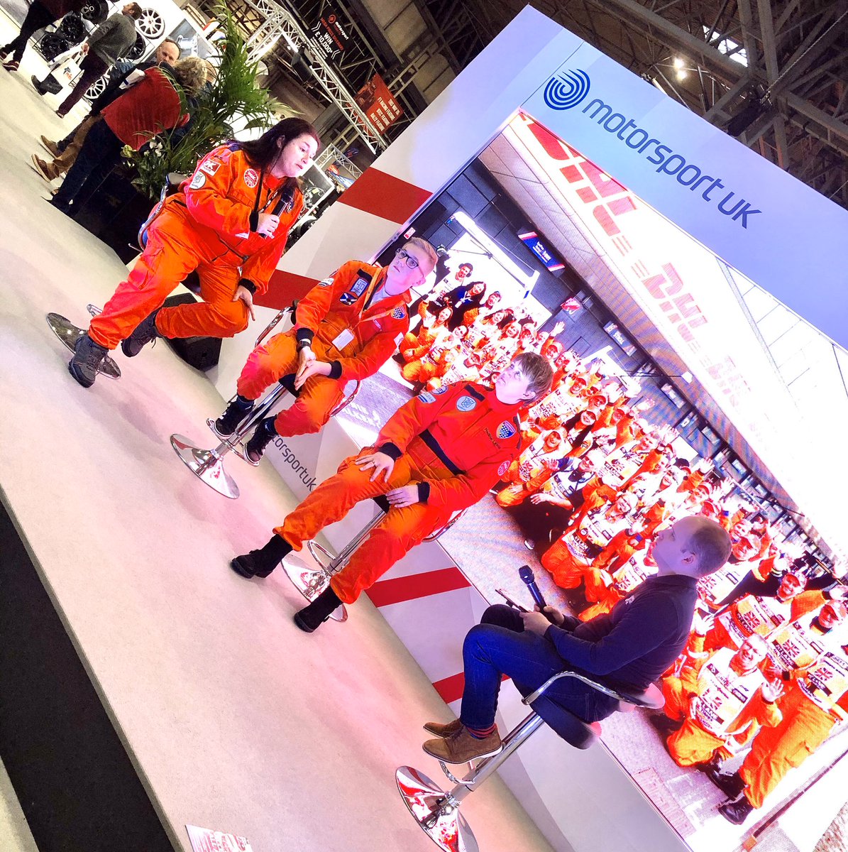 BMMCUK's tweet photo. Our #OrangeFamily on the @ourmotorsportuk stand promoting the benefits of being a marshal at @Autosport_Show including @NadineJLewis @PrincessLuckyJa https://t.co/YwDNyEs2pZ