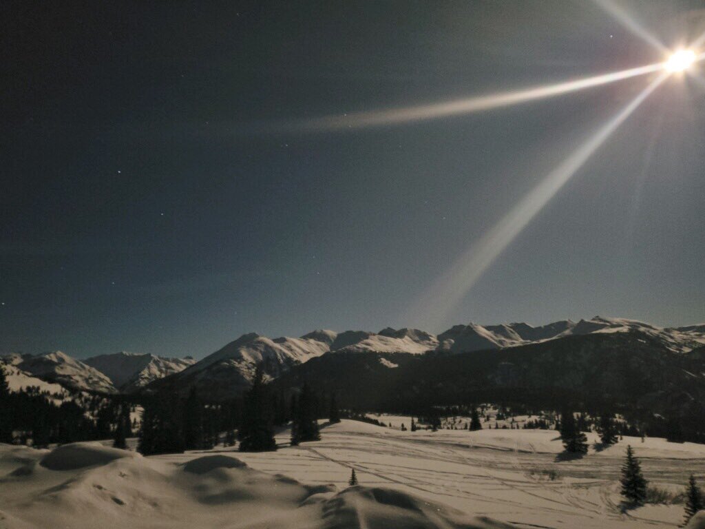 ColoradoDOT's tweet photo. Moonbeams over Molas! 
Maintenance equipment operator, Clint Rhoades captured this illuminating image of last night’s full moon while on patrol on US 550  just south of Silverton. 

#SWCODOT #MolasPass #US550 #SanJuanSkyway #Moonbeams https://t.co/P5PER6B0sm