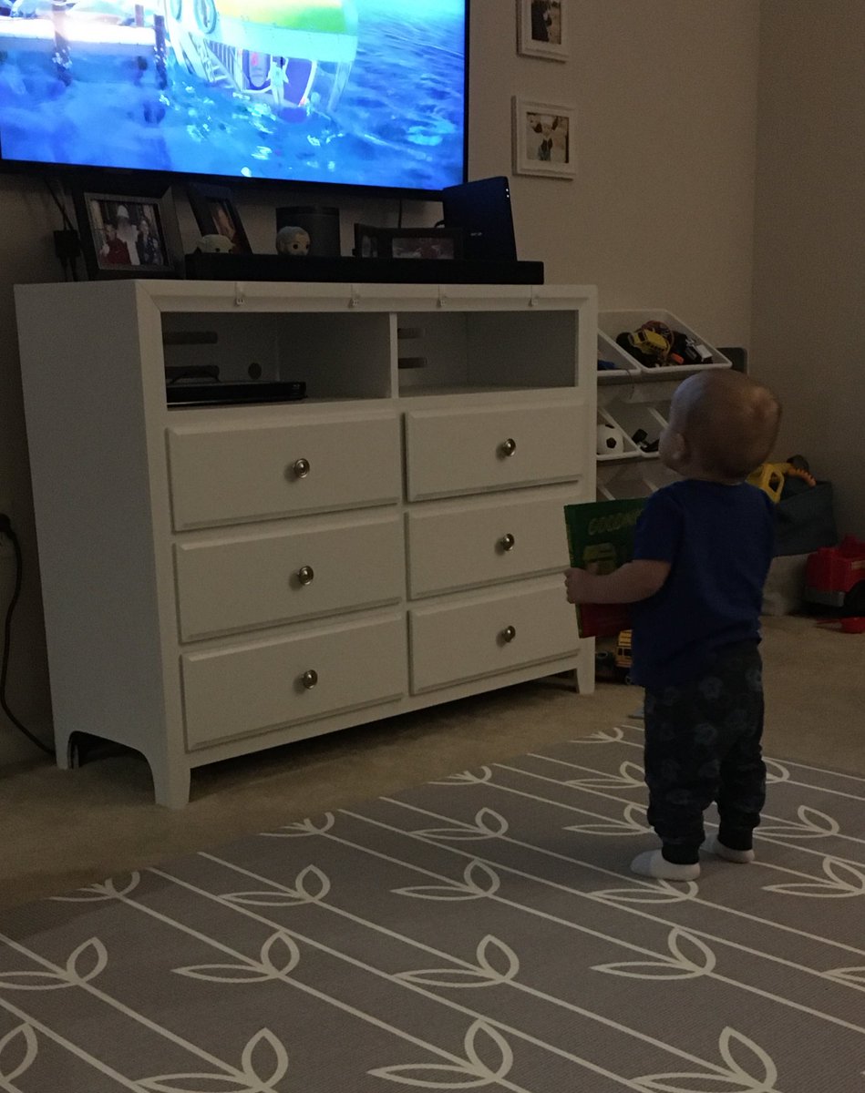 morgan_morris99's tweet photo. Here’s some pics of my baby brother w/ his book bc he won’t let go of it today and I had to share the cuteness https://t.co/mQO4RZ0j4A